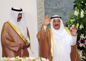 FILE PHOTO: Kuwait's Emir Sheikh Sabah al-Ahmad al-Sabah waves at the start of the forth session of the 13th legislative term of the parliament as Crown Prince Sheikh Nawaf al-Ahmad al-Sabah stands to his side in Kuwait City October 25, 2011. REUTERS/Stephanie McGehee/File Photo