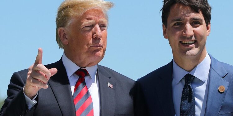 U.S. President Donald Trump, left, is greeted by Prime Minister Justin Trudeau at the G7 summit in La Malbaie, Quebec on June 8, 2018.