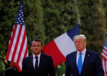 U.S President Donald Trump and French President Emmanuel Macron attend a French-American commemoration ceremony for the 75th anniversary of D-Day at the American cemetery of Colleville-sur-Mer in Normandy, France, June 6, 2019.