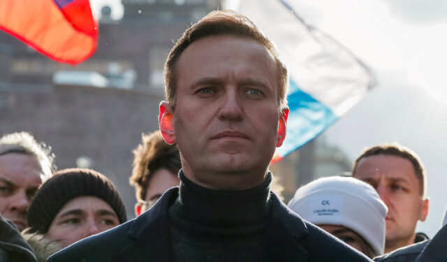 FILE PHOTO: Russian opposition politician Alexei Navalny takes part in a rally to mark the 5th anniversary of opposition politician Boris Nemtsov's murder and to protest against proposed amendments to the country's constitution, in Moscow, Russia February 29, 2020. REUTERS/Shamil Zhumatov -/File Photo
