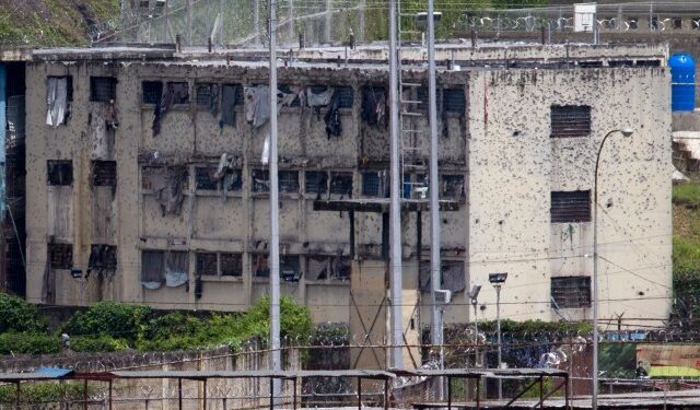 The partially destroyed facilities by gunfire of 'El Rodeo' prison is seen in Guatire outside Caracas June 19, 2011. The prisoners are being moved as gunbattles between inmates have killed at least 25 people in the latest riots to rock the overcrowded prison system. President Hugo Chavez's government announced this week a new Prisons Ministry to try to control chaos inside jails where inmates traffic drugs, carry guns, mastermind crime outside via telephones and control whole blocks by themselves. REUTERS/Carlos Garcia Rawlins (VENEZUELA - Tags: POLITICS CRIME LAW)