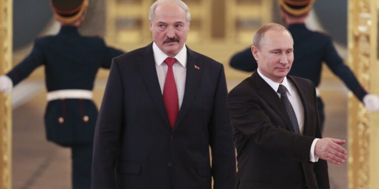 Russia's President Vladimir Putin (R) and his Belarus' counterpart Alexander Lukashenko walk in as they attend a session of the Supreme State Council of the Union State at the Kremlin in Moscow on March 3, 2015. AFP PHOTO / POOL / SERGEI KARPUKHIN        (Photo credit should read SERGEI KARPUKHIN/AFP via Getty Images)