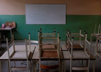 Empty desks are seen in the classroom on the first day of school, in Caucagua, Venezuela September 17, 2018. REUTERS/Marco Bello