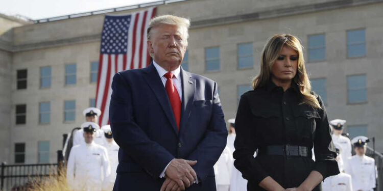 President Donald Trump and first lady Melania Trump participate in a moment of silence honoring the victims of the Sept. 11 terrorist attacks, Wednesday, Sept. 11, 2019, at the Pentagon. (AP Photo/Evan Vucci)