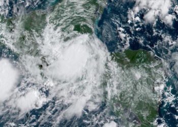 This NOAA/GOES satellite image shows Hurricane Nana (R) over Guatemala and Belize at 14:30UTC, on September 3, 2020. - Central American countries were preparing for the onslaught of Hurricane Nana, which hit the coast of Belize during the early hours of September 3, 2020. Nana, recently upgraded from a tropical storm, had made landfall between Dangriga and Placencia, towards the middle of Belize's coastline, about 60 kilometers south of Belize City, the US National Hurricane Center said just after midnight Belize time (0600 GMT). (Photo by Handout / NOAA/GOES / AFP) / RESTRICTED TO EDITORIAL USE - MANDATORY CREDIT "AFP PHOTO / NOAA/GOES" - NO MARKETING - NO ADVERTISING CAMPAIGNS - DISTRIBUTED AS A SERVICE TO CLIENTS