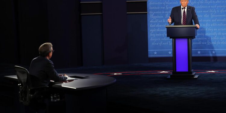 CLEVELAND, OHIO - SEPTEMBER 29:  U.S. President Donald Trump participates in the first presidential debate against Democratic presidential nominee Joe Biden,  moderated by Fox News anchor Chris Wallace (L) at the Health Education Campus of Case Western Reserve University on September 29, 2020 in Cleveland, Ohio. This is the first of three planned debates between the two candidates in the lead up to the election on November 3.  (Photo by Win McNamee/Getty Images)