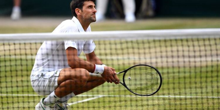 Novak Djokovic after beating Roger Federer in the mens singles final on day thirteen of the Wimbledon Championships at the All England Lawn Tennis and Croquet Club, Wimbledon.