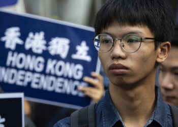 epa08782290 (FILE) - Tony Chung Hon-lam, leader of pro-Hong Kong independence group 'Student Localism' marches through the streets of Hong Kong during the annual New Year's Day protest, Hong Kong, China, 01 January 2019 (reissued 29 October 2020). According to media reports, under the national security law on 29 October, police charged Tony Chung with secession, money laundering and conspiracy to publish seditious material. Chung was arrested on 27 October by plain-clothed police officers near the US consulate in Hong Kong where he was allegedly seeking asylum.  EPA-EFE/ALEX HOFFORD