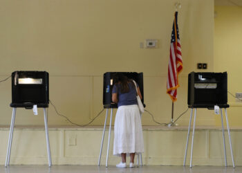 MIAMI, FLORIDA - NOVEMBER 03: Gissele Riberiro fills out her ballot as she votes at the Legion Park polling place on November 03, 2020 in Miami, Florida.  After a record-breaking early voting turnout, Americans head to the polls on the last day to cast their vote for incumbent U.S. President Donald Trump or Democratic nominee Joe Biden in the 2020 presidential election. (Photo by Joe Raedle/Getty Images)