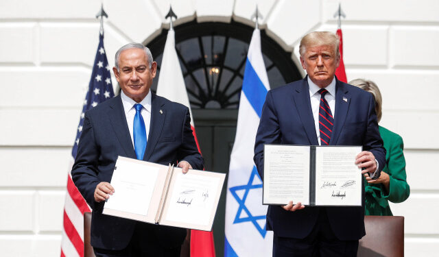 Israel's Prime Minister Benjamin Netanyahu stands with U.S. President Donald Trump after signing the Abraham Accords, normalizing relations between Israel and some of its Middle East neighbors,  in a strategic realignment of Middle Eastern countries against Iran, on the South Lawn of the White House in Washington, U.S., September 15, 2020. REUTERS/Tom Brenner