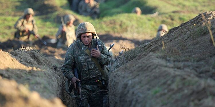 Armenian soldiers take their position on the front line in Tavush region, Armenia, Tuesday, July 14, 2020. Skirmishes on the volatile Armenia-Azerbaijan border escalated Tuesday, marking the most serious outbreak of hostilities between the neighbors since the fighting in 2016. (Armenian Defense Ministry Press Service/PanPhoto via AP)