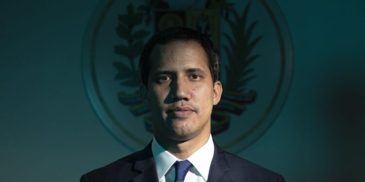 Juan Guaido, president of the National Assembly who swore himself in as the leader of Venezuela, stands for a photograph following an interview at his office in Caracas, Venezuela, on Thursday, Sept. 19, 2019. The U.S. last week said it was joining Guaido and ten other countries in invoking the Inter-American Treaty of Reciprocal Assistance, known as the Rio Treaty, which is a regional mutual defense agreement that could establish a legal path for military intervention. Photographer: Carlos Becerra/Bloomberg