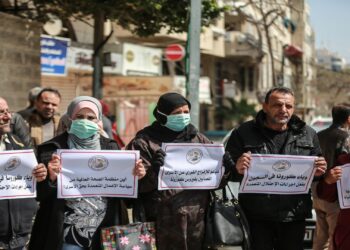 GAZA CITY, GAZA - MARCH 19: Palestinians gather for a demonstration to demand coronavirus (COVID-19) protection for Palestinian prisoners held in Israeli jails, in Gaza City, Gaza on March 19, 2020. (Photo by Ali Jadallah/Anadolu Agency via Getty Images)