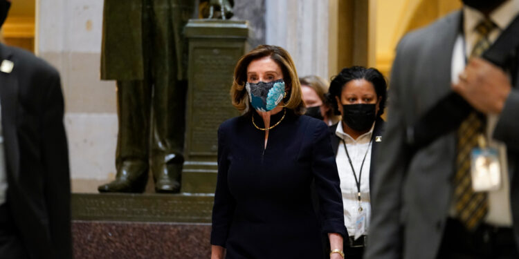 Speaker of the House Nancy Pelosi of Calif., walks through Statuary Hall on Capitol Hill in Washington, Wednesday, Jan. 13, 2021. (AP Photo/Susan Walsh)