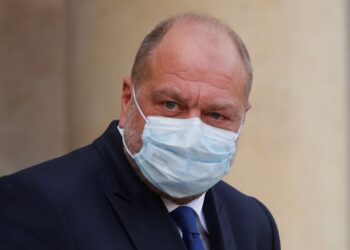 French Justice Minister Eric Dupond-Moretti, wearing a protective face mask, leaves following the weekly cabinet meeting at the Elysee Palace in Paris, France, October 14, 2020. REUTERS/Charles Platiau