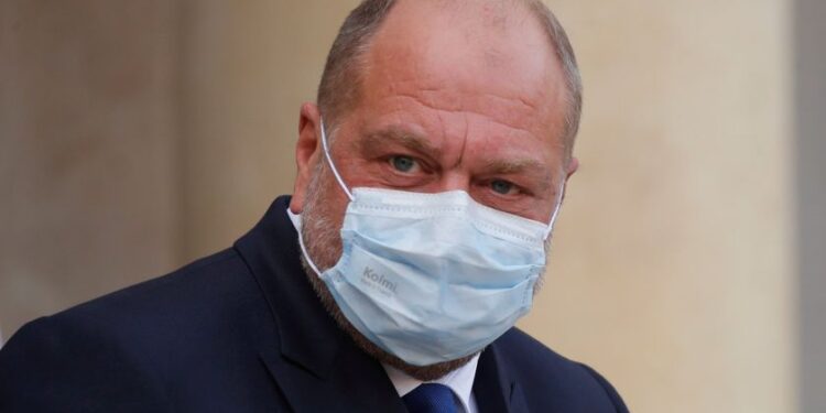 French Justice Minister Eric Dupond-Moretti, wearing a protective face mask, leaves following the weekly cabinet meeting at the Elysee Palace in Paris, France, October 14, 2020. REUTERS/Charles Platiau