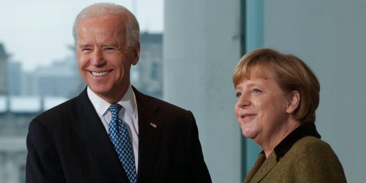 FILE - In this Friday, Feb. 1, 2013 file photo German Chancellor Angela Merkel, right, shakes hands with then United States' Vice President Joe Biden after a media briefing prior to a meeting at the chancellery in Berlin, Germany. President-elect Joe Biden brings decades of experience in domestic and foreign policy to the job, and ?he knows Germany and Europe well," Merkel said in her first comments in person on the US election outcome. The chancellor had congratulated Biden and Vice President-elect Kamala Harris in writing on Saturday. (AP Photo/Markus Schreiber)