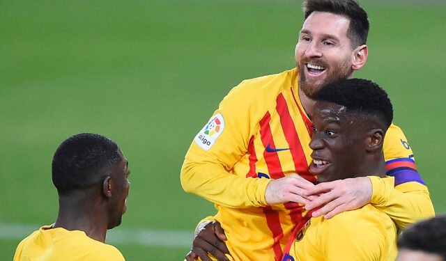 Barcelona's Spanish midfielder Ilaix Moriba (R) celebrates with Barcelona's Argentinian forward Lionel Messi and Barcelona's French forward Ousmane Dembele after scoring during the Spanish League football match between CA Osasuna and FC Barcelona at El Sadar stadium in Pamplona on March 6, 2021. (Photo by ANDER GILLENEA / AFP)