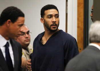 Former NFL football player Kellen Winslow Jr., center, leaves his arraignment Friday, June 15, 2018, in Vista, Calif. The former tight end was arrested Thursday on charges of rape and other sex crimes, the day he was to appear in court on an unrelated burglary charge. (Hayne Palmour/San Diego Union-Tribune via AP, Pool)