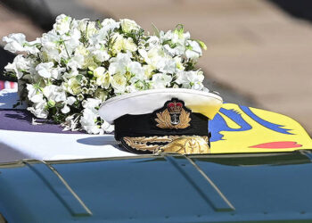 WINDSOR, ENGLAND - APRIL 17: Prince Philip, Duke of Edinburgh's Royal Navy cap sits on his coffin, which covered with His Royal Highness’s Personal Standard during the Ceremonial Procession during the funeral of Prince Philip, Duke of Edinburgh at Windsor Castle on April 17, 2021 in Windsor, England. Prince Philip of Greece and Denmark was born 10 June 1921, in Greece. He served in the British Royal Navy and fought in WWII. He married the then Princess Elizabeth on 20 November 1947 and was created Duke of Edinburgh, Earl of Merioneth, and Baron Greenwich by King VI. He served as Prince Consort to Queen Elizabeth II until his death on April 9 2021, months short of his 100th birthday. His funeral takes place today at Windsor Castle with only 30 guests invited due to Coronavirus pandemic restrictions. (Photo by Leon Neal/WPA Pool/Getty Images  )