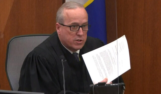 Hennepin County District Judge Peter Cahill gives instructions to the jury before closing arguments commence during the trial of former Minneapolis police officer Derek Chauvin for second-degree murder, third-degree murder and second-degree manslaughter in the death of George Floyd in Minneapolis, Minnesota, U.S. April 19, 2021 in a still image from video.  Pool via REUTERS