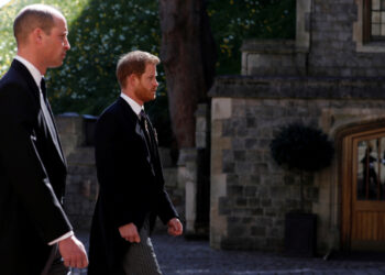 Britain's Prince William and Britain's Prince Harry follow the hearse, a specially modified Land Rover, towards St. George's Chapel, during the funeral of Britain's Prince Philip, husband of Queen Elizabeth, who died at the age of 99, in Windsor, Britain, April 17, 2021. Alastair Grant/Pool via REUTERS     TPX IMAGES OF THE DAY