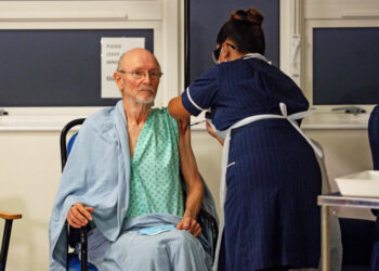 "Bill" William Shakespeare, 81, receives the Pfizer/BioNTech  COVID-19 vaccine at University Hospital, at the start of the largest ever immunisation programme in the British history, in Coventry, Britain December 8, 2020. Britain is the first country in the world to start vaccinating people with the Pfizer/BioNTech jab. Jacob King/Pool via REUTERS     TPX IMAGES OF THE DAY