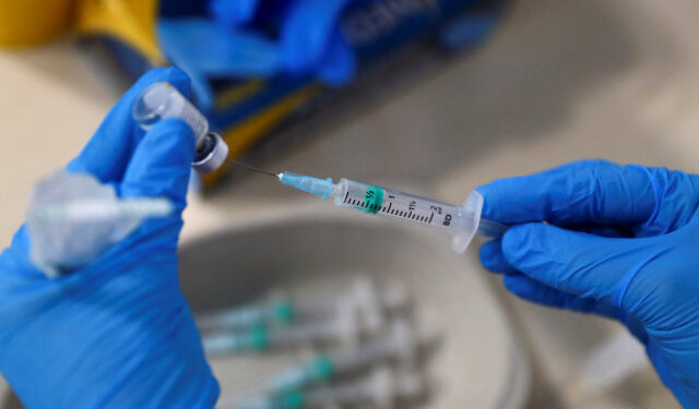 A nurse fills a syringe with a second dose of the Pfizer-BioNTech COVID-19 vaccine, as the coronavirus disease (COVID-19) outbreak continues, at Enfermera Isabel Zendal new pandemic hospital in Madrid, Spain, February 4, 2021. REUTERS/Sergio Perez