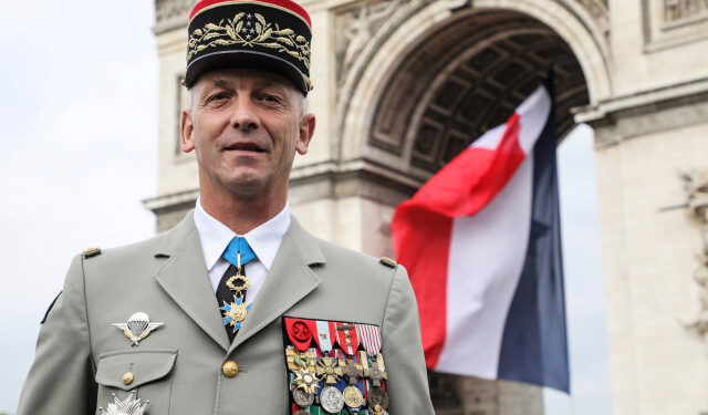 French armies chief of staff general François Lecointre pose in front of the Arc de Triomphe in the Place Charles-de-Gaulle square ontop of the Champs-Elysees avenue in Paris prior to the Bastille Day military parade on July 14, 2019. (Photo by LUDOVIC MARIN / AFP)