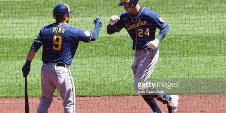 ST. LOUIS, MO - APRIL 11: Milwaukee Brewers catcher Manny Pina (9) congratulates Milwaukee Brewers centerfielder Avisail Garcia (24) after his home run during a Major League baseball game between the Milwaukee Brewers and the St. Louis Cardinals on April 11, 2021, at Busch Stadium, St. Louis, Mo. (Photo by Keith Gillett/Icon Sportswire via Getty Images),