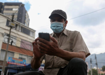 Pablo Toro, Venezuelan delivery worker uses the Valiu app from his cell phone in Bogota, Colombia June 15, 2021. Picture taken June 15, 2021. REUTERS/Luisa Gonzalez