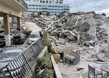 Emergency personnel work at the site of a partially collapsed building in Miami Beach, Florida, U.S., June 24, 2021. Miami-Dade Fire Rescue/Handout via REUTERS  THIS IMAGE HAS BEEN SUPPLIED BY A THIRD PARTY.