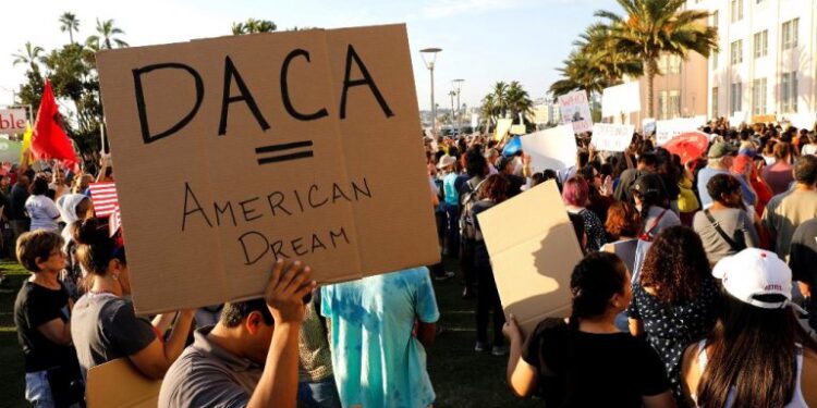 FILE PHOTO:    Alliance San Diego and other Pro-DACA supporters hold a protest rally, following U.S. President Donald Trump's DACA announcement, in front of San Diego County Administration Center in San Diego, California, U.S., September 5, 2017.   REUTERS/John Gastaldo/File Photo