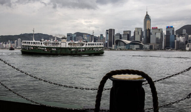 (FILES) In this file photo taken on July 15, 2021, a Star Ferry crosses Victoria Harbour in Hong Kong. - The US on July 16, 2021, warned its business community of growing risks of operating in Hong Kong following a clampdown by China in the major financial hub. In a long-awaited advisory that has already been denounced by China, US government agencies led by the State Department told entrepreneurs that they face particular risks from the imposition a year ago of a draconian new security law. (Photo by ISAAC LAWRENCE / AFP)
