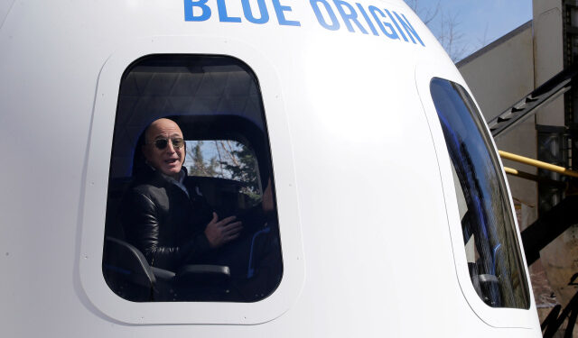 FILE PHOTO: Amazon and Blue Origin founder Jeff Bezos addresses the media about the New Shepard rocket booster and Crew Capsule mockup at the 33rd Space Symposium in Colorado Springs, Colorado, United States April 5, 2017.  REUTERS/Isaiah J. Downing/File Photo