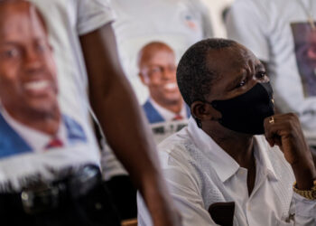 A man cries during the wake of slain Haitian President Jovenel Moise at Notre Dame Cathedral in Cap-Haitien, Haiti July 22, 2021. REUTERS/Ricardo Arduengo