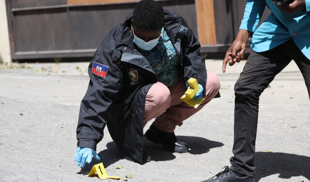 Members of the Haitian police and forensics look for evidence outside of the  presidential residence on July 7, 2021 in Port-au-Prince, Haiti. - Haiti President Jovenel Moise was assassinated and his wife wounded early July 7, 2021 in an attack at their home, the interim prime minister announced, an act that risks further destabilizing the Caribbean nation beset by gang violence and political volatility. Claude Joseph said he was now in charge of the country and urged the public to remain calm, while insisting the police and army would ensure the population's safety.The capital Port-au-prince as quiet on Wednesday morning with no extra security forces on patrol, witnesses reported. (Photo by VALERIE BAERISWYL / AFP)