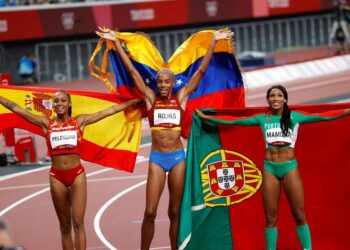 Gold medalist Yulimar Rojas (C) of Venezuela, Silver medalist Patricia Mamona (R) of Portugal and bronze medalist Ana Peleteiro (L) of Spain celebrate after the Women's triple jump final during the Athletics events of the Tokyo 2020 Olympic Games at the Olympic Stadium in Tokyo, Japan, 01 August 2021. (Triple salto, Japón, España, Tokio) EFE/EPA/HOW HWEE YOUNG