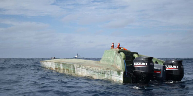 The U.S. Coast Guard Cutter Midgett (WMSL 757) seen with a low-profile go-fast vessel interdicted in international waters of the Eastern Pacific Ocean July 26, 2019. Midgett crew members boarded the suspected drug-smuggling vessel seizing more than 2,100 pounds of cocaine during the cutter’s transit from the Pascagoula shipyard where Midgett was built to the cutter’s future homeport in Honolulu where the cutter is scheduled for commissioning during a dual-commissioning ceremony August 24, 2019 with Midgett’s sister ship the Coast Guard Cutter Kimball (WMSL 756). U.S. Coast Guard photo.