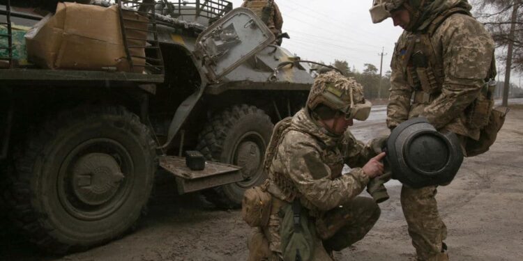 Ukrainian servicemen prepare a Swedish-British portable anti-tank guided missile NLAW before an attack in Lugansk region on February 26, 2022. - Russia on February 26 ordered its troops to advance in Ukraine "from all directions" as the Ukrainian capital Kyiv imposed a blanket curfew and officials reported 198 civilian deaths. (Photo by Anatolii Stepanov / AFP) (Photo by ANATOLII STEPANOV/AFP via Getty Images)