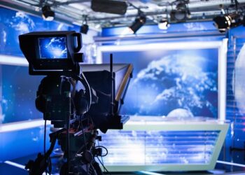 Video camera - recording show in TV studio - focus on camera