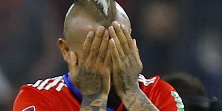 Chile's Arturo Vidal reacts after losing against Uruguay the South American qualification football match between Chile and Uruguay, failing to qualify for the FIFA World Cup Qatar 2022, at the San Carlos de Apoquindo Stadium in Santiago on March 29, 2022. (Photo by Marcelo HERNANDEZ / POOL / AFP)