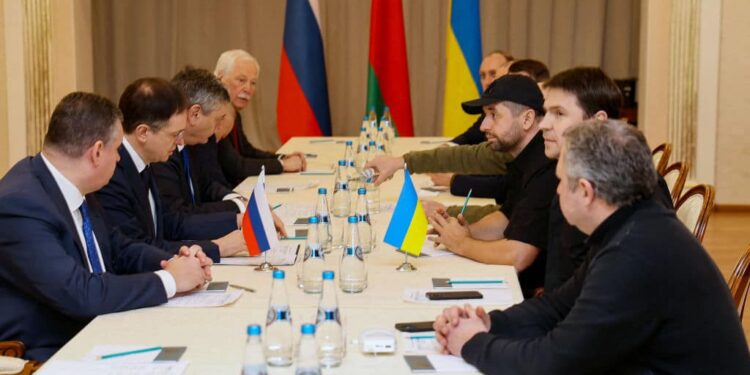 Members of delegations from Ukraine and Russia, including Russian presidential aide Vladimir Medinsky (2L), Ukrainian presidential aide Mykhailo Podolyak (2R), Volodymyr Zelensky's "Servant of the People" lawmaker Davyd Arakhamia (3R), hold talks in Belarus' Gomel region on February 28, 2022, following the Russian invasion of Ukraine. - Belarus OUT (Photo by Sergei KHOLODILIN / BELTA / AFP) / Belarus OUT (Photo by SERGEI KHOLODILIN/BELTA/AFP via Getty Images)