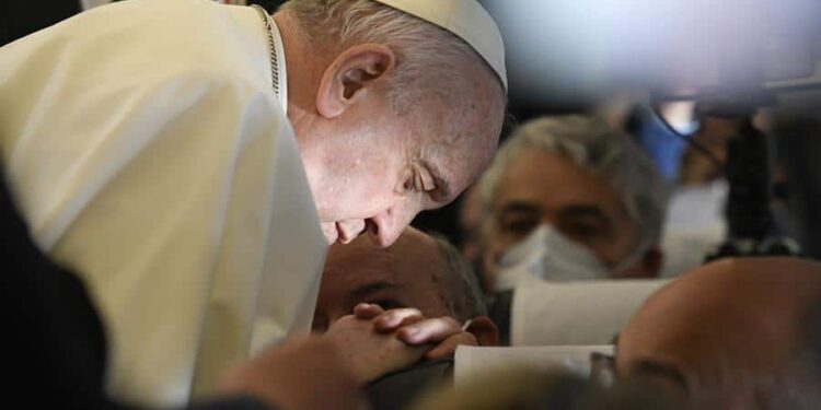 A handout picture provided by the Vatican Media shows Pope Francis praying aboard the plane on his way to Malta International Airport, ahead of his apostolic visit in Luqa, Malta, 02 April 2022. Pope Francis departs for a two-day trip to Malta.