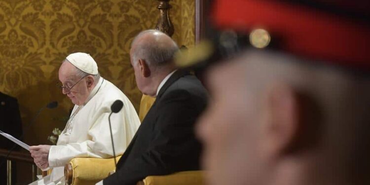 A handout picture provided by the Vatican Media shows Malta's President George Vella (C) and Pope Francis as they both address the authorities and the diplomatic corps in the Grand Council Chamber of the Grand Master's Presidential Palace in Valletta, Malta, 02 April, 2022.