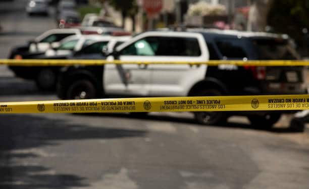 Los Angeles, California, USA - May 15, 2021: Cordon tape secures the scene of an LAPD incident.