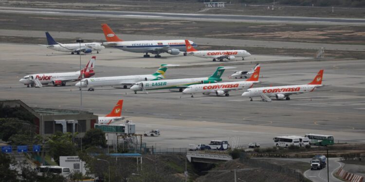 Avior, Estelar, Conviasa and Laser planes are seen at Simon Bolivar airport in Caracas, Venezuela July 2, 2018. Picture taken July 2, 2018. REUTERS/Marco Bello