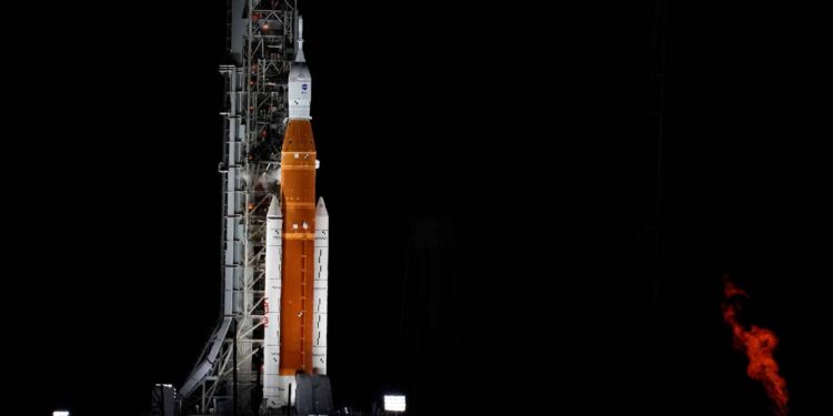 NASA's new moon rocket sits on Launch Pad 39-B hours before liftoff Monday, Aug. 29, 2022, in Cape Canaveral, Fla. This is scheduled to be the first flight of NASA's 21st-century moon-exploration program, named Artemis after Apollo's mythological twin sister. (AP Photo/Chris O'Meara)