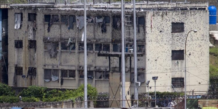 The partially destroyed facilities by gunfire of 'El Rodeo' prison is seen in Guatire outside Caracas June 19, 2011. The prisoners are being moved as gunbattles between inmates have killed at least 25 people in the latest riots to rock the overcrowded prison system. President Hugo Chavez's government announced this week a new Prisons Ministry to try to control chaos inside jails where inmates traffic drugs, carry guns, mastermind crime outside via telephones and control whole blocks by themselves. REUTERS/Carlos Garcia Rawlins (VENEZUELA - Tags: POLITICS CRIME LAW)