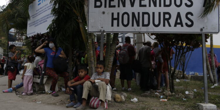 EL FLORIDO, GUATEMALA - JANUARY 18: A group of Honduran migrants rest as waiting to return to their country on January 18, 2021 in El Florido, Guatemala. The caravan departed from Honduras to walk across Guatemala and Mexico to eventually reach the United States. After clashing with the police yesterday migrants are being held to carry out immigration and heath controls. Central Americans expect to receive asylum and most Hondurans decided to migrate after being hit by recent hurricanes.  (Photo by Josue Decavele/Getty Images)